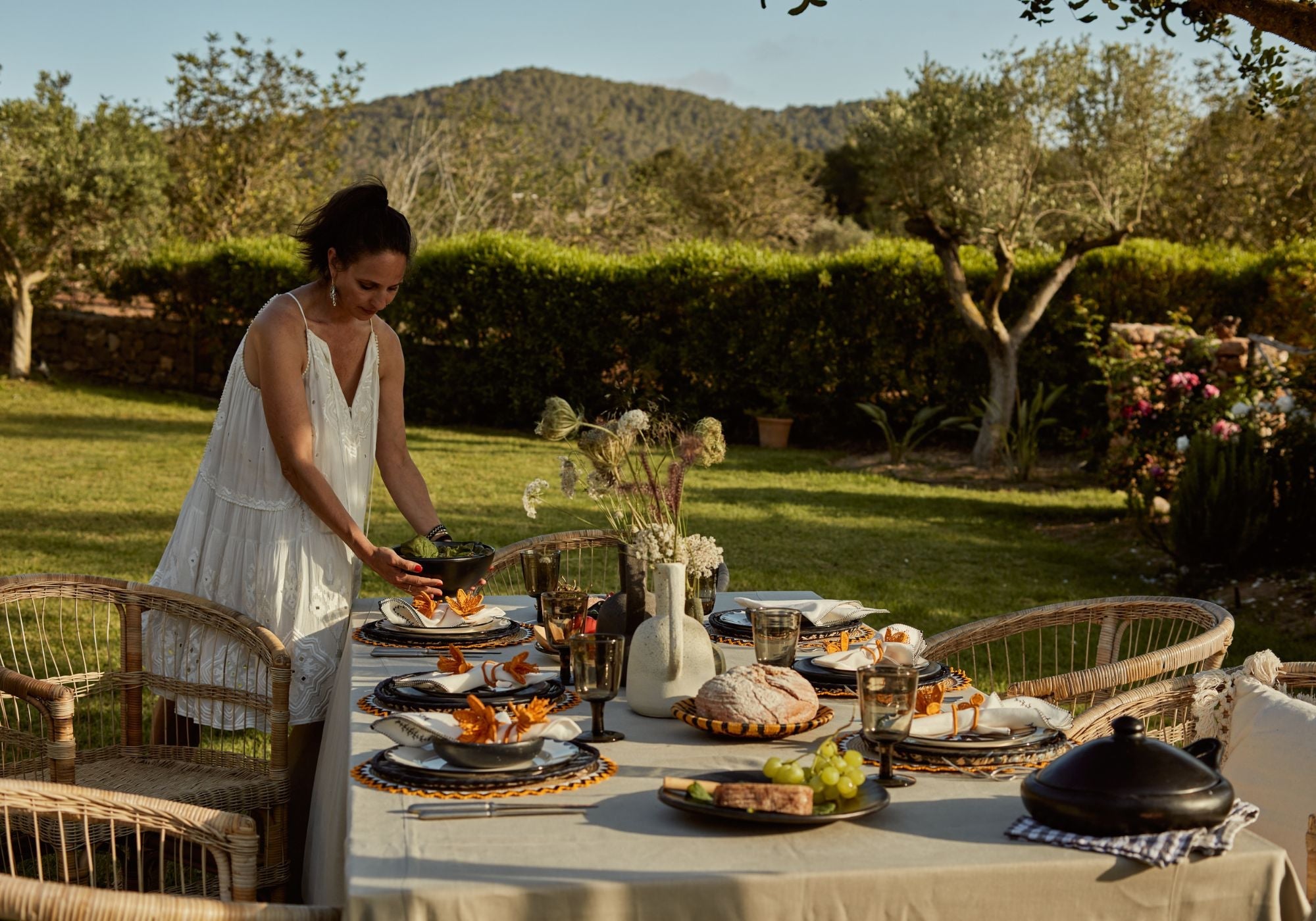 Summer hosting table, hand painted plates, woves placemats chamba plates