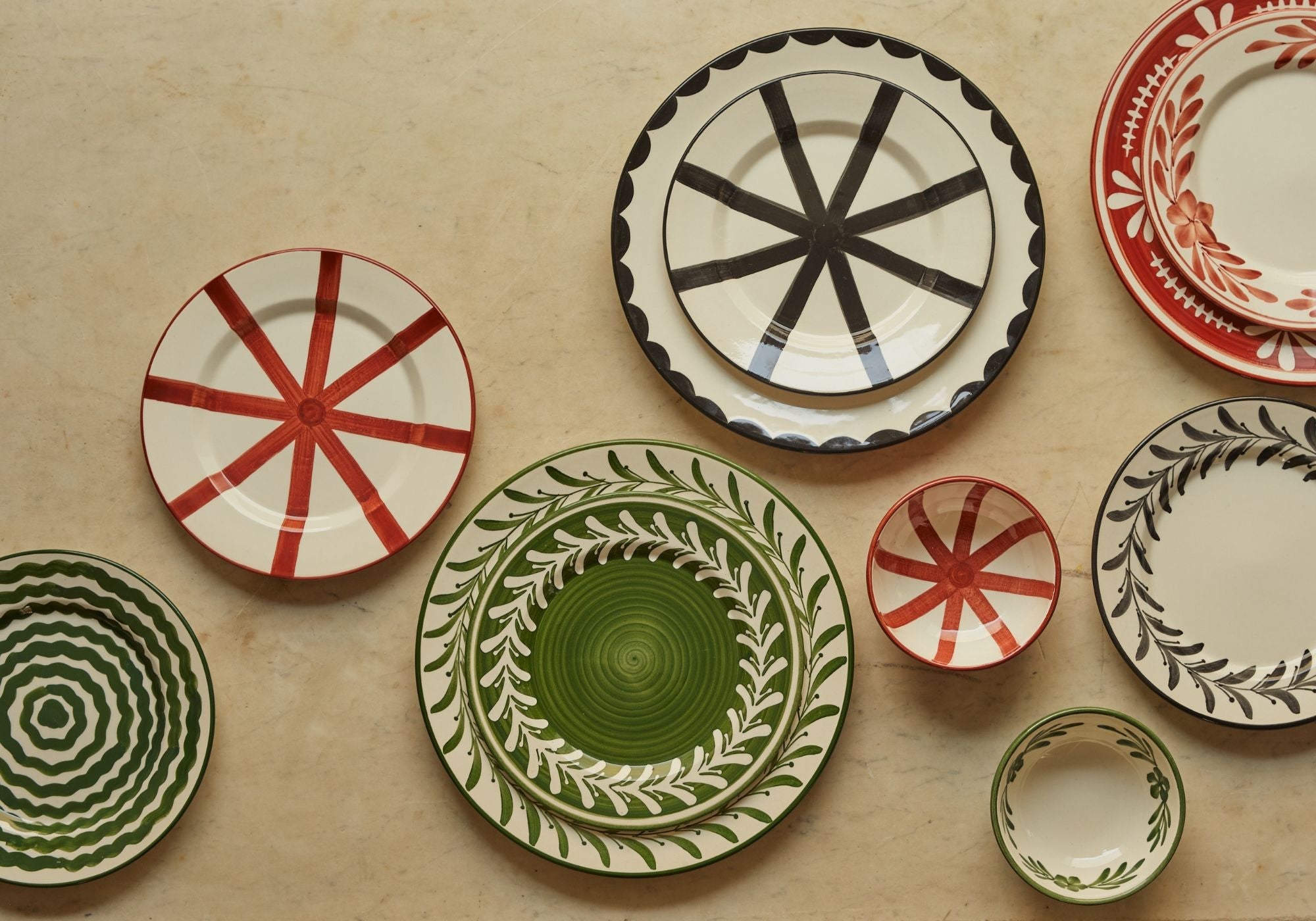 Mix of hand painted plates in green, red ad black