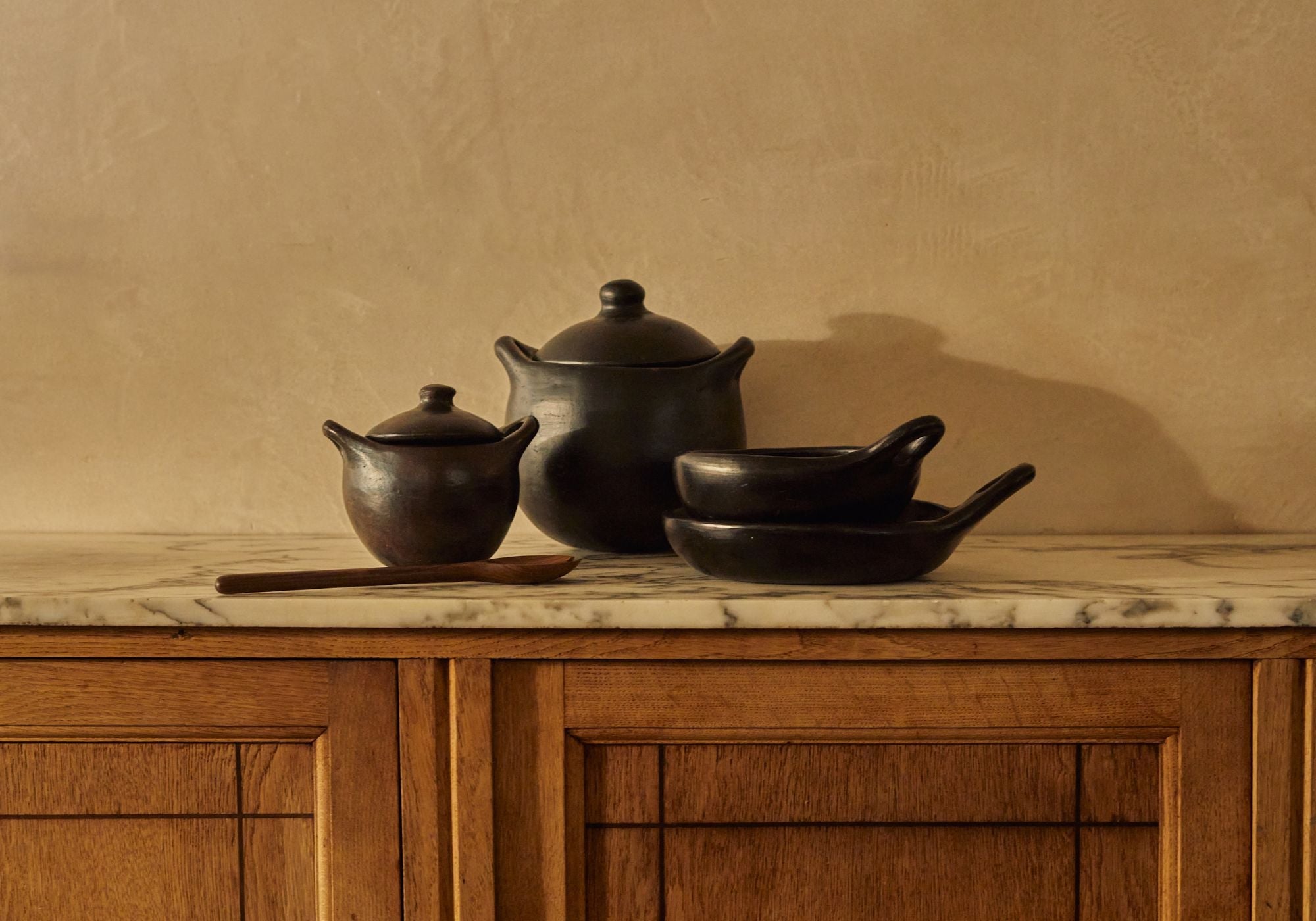 Colombian black pottery handmade in La Chamba. Cocottes and pans