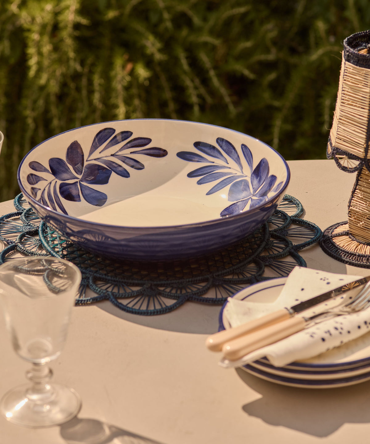 Deep Blue Flor large salad bowl on the table, hand-painted floral ceramic from Carmen del Viboral