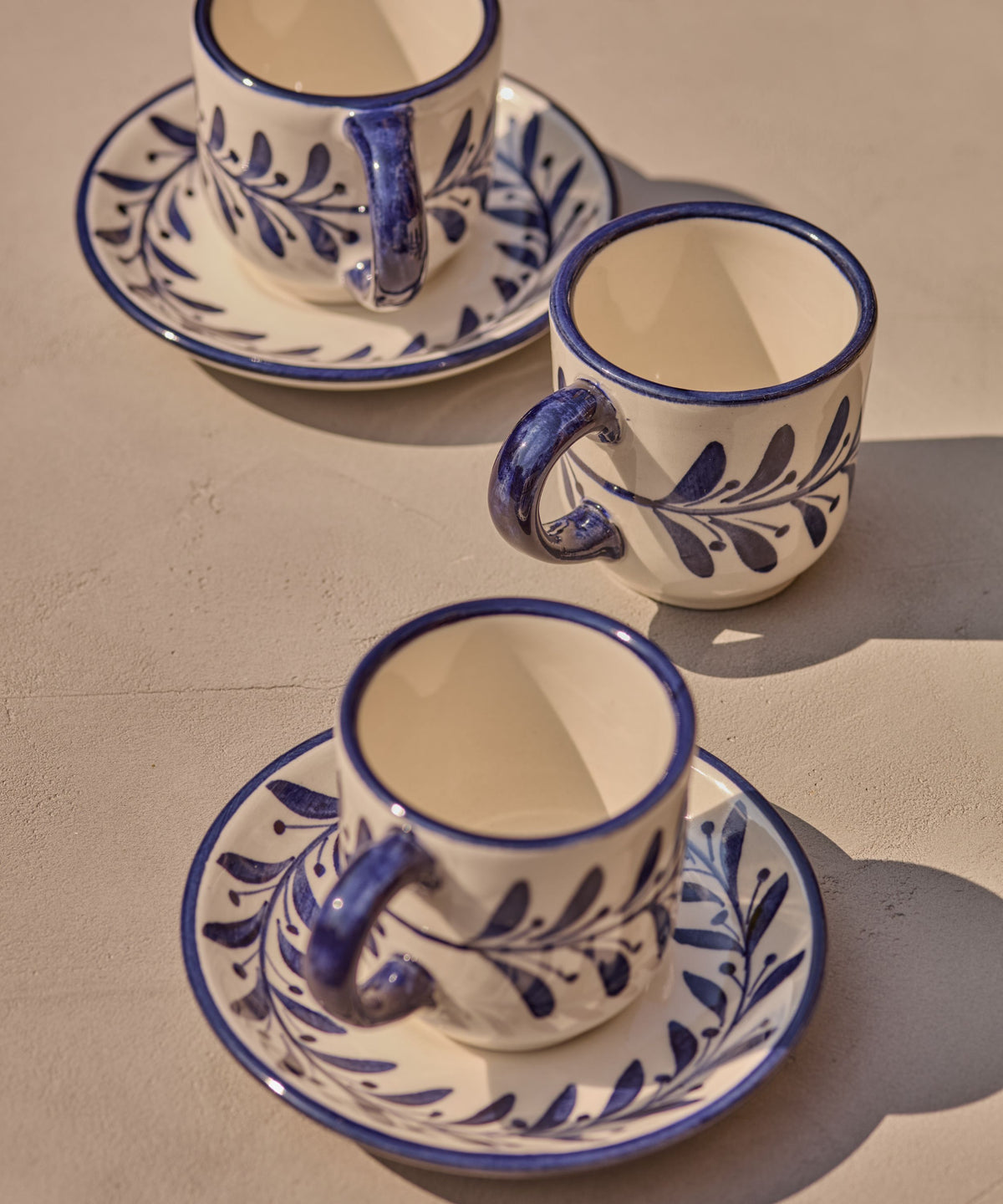 Deep Blue Helecho espresso cup and saucer with freehand fern wreath, hand-painted ceramic