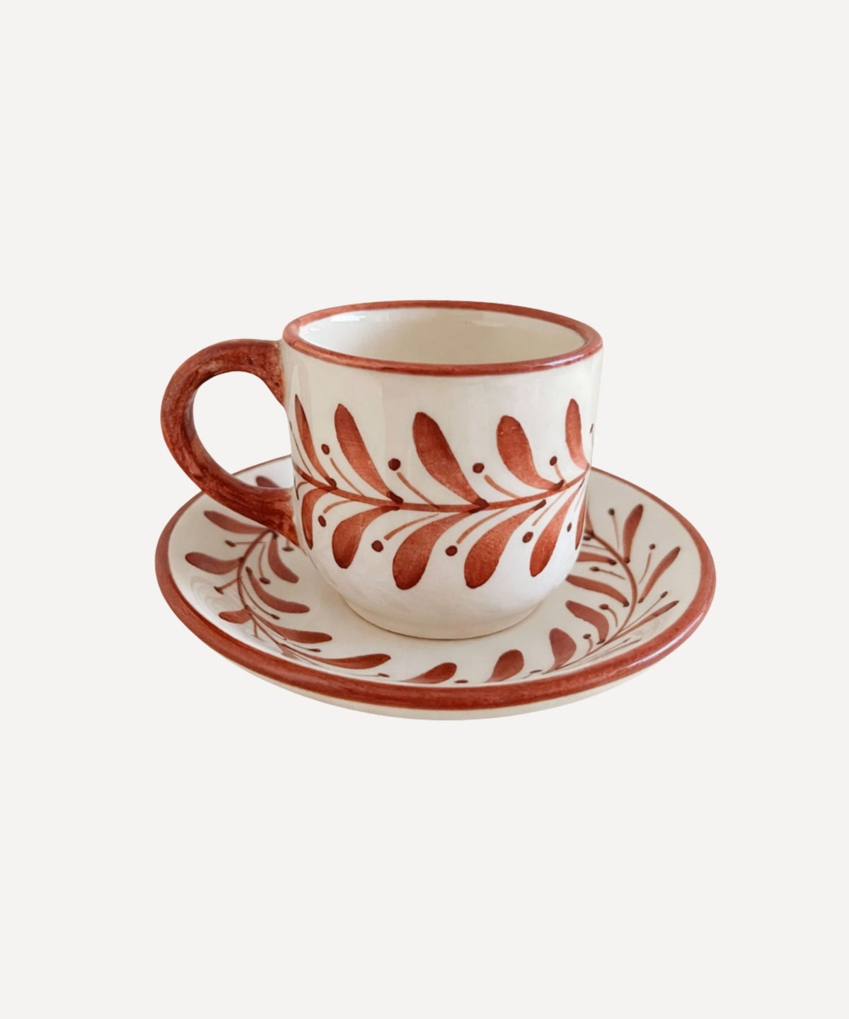 Helecho Coffee Cup in Rust Red — hand-painted fern wreath ceramic with matching saucer, Carmen del Viboral, Colombia
