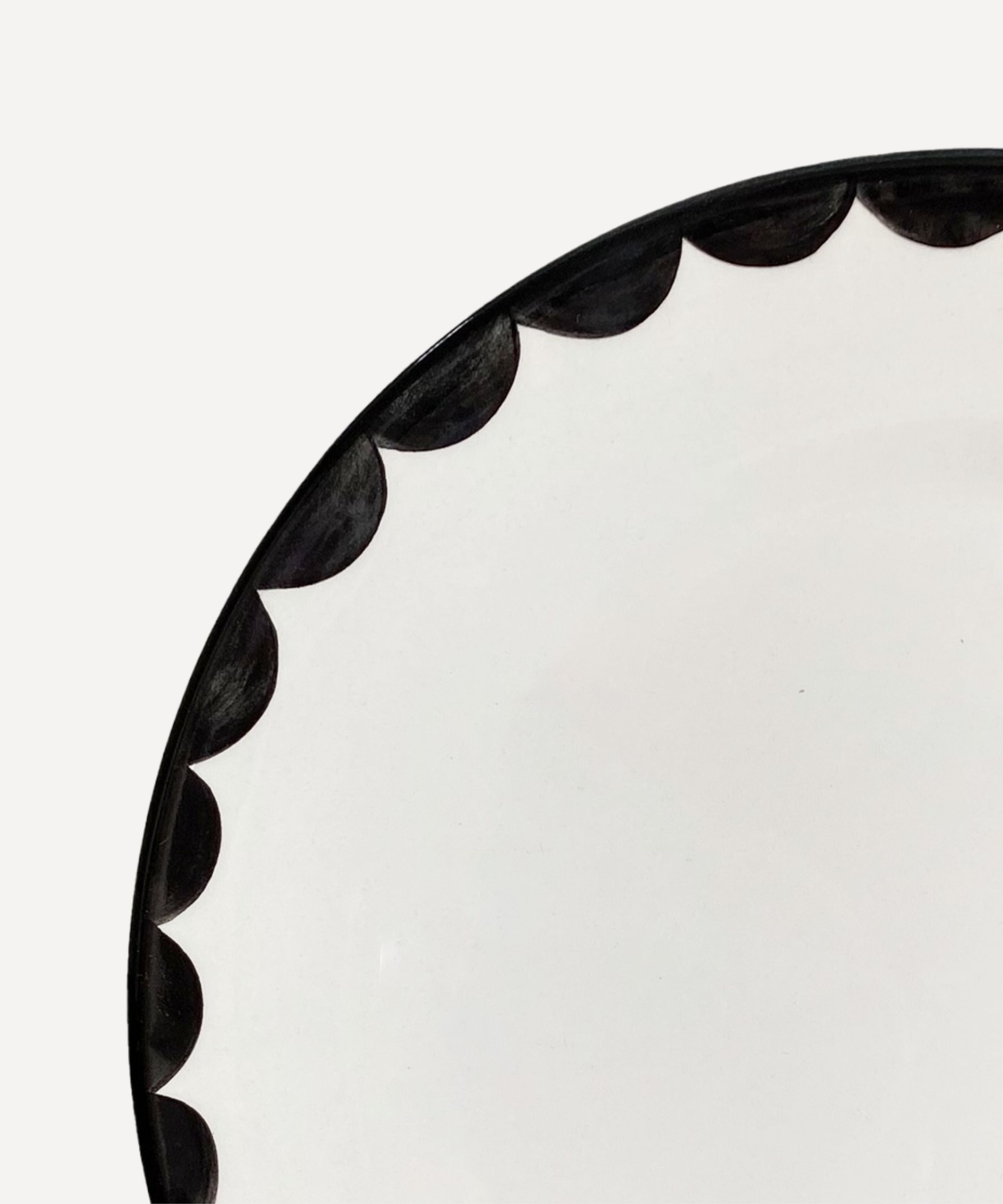 Jet Black Cascos side plate, softly scalloped silhouette, hand-painted ceramic