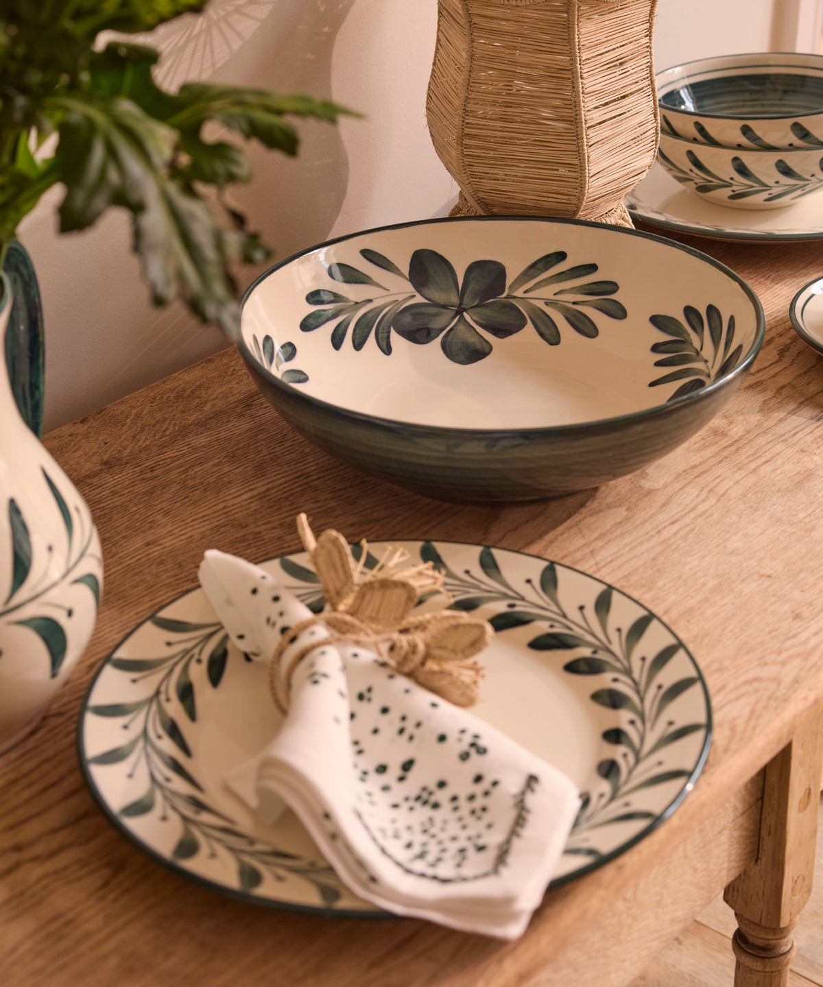 Teal Flor large salad bowl on the table, hand-painted floral ceramic from Carmen del Viboral
