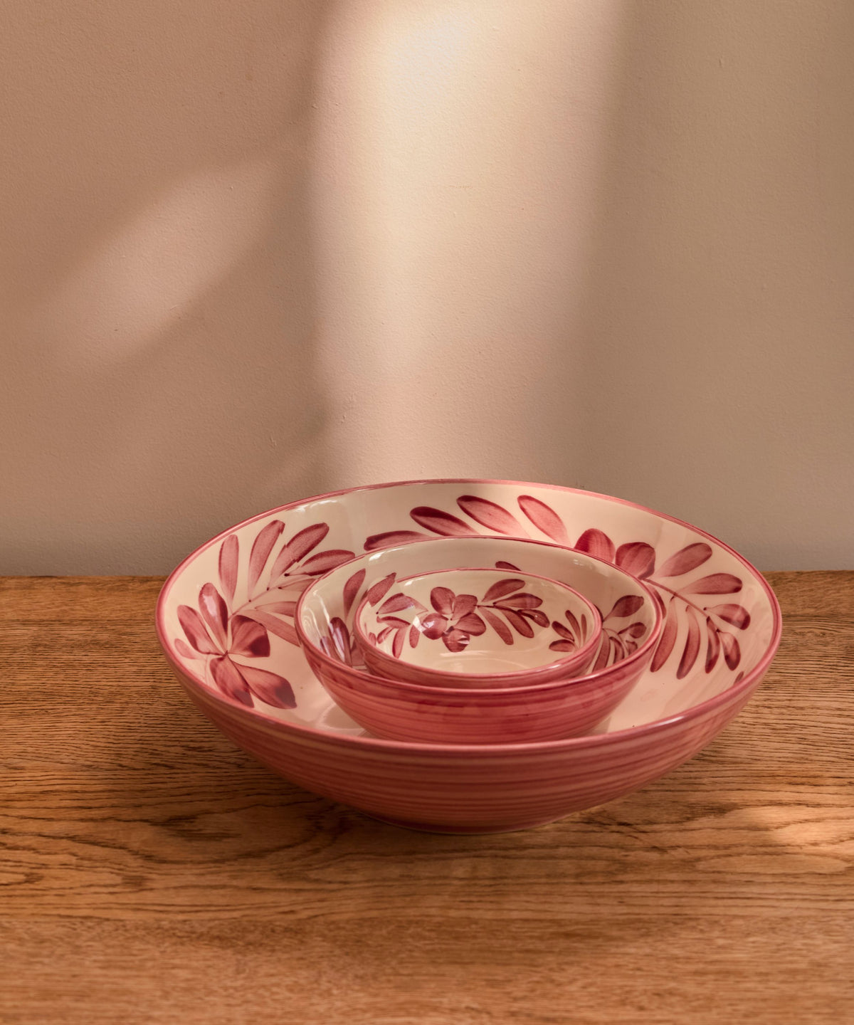 Vintage Rose Flor large salad bowl on the table, hand-painted floral ceramic from Carmen del Viboral