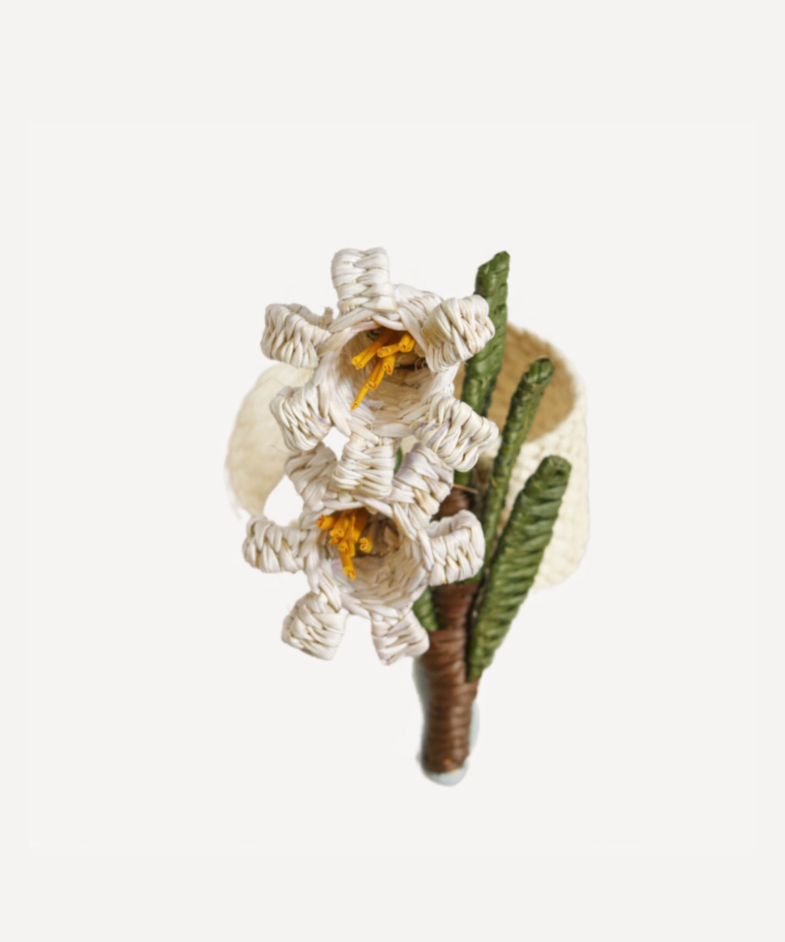 Wild Flower napkin ring, Lily of the Valley, handwoven iraca palm, holding a folded napkin